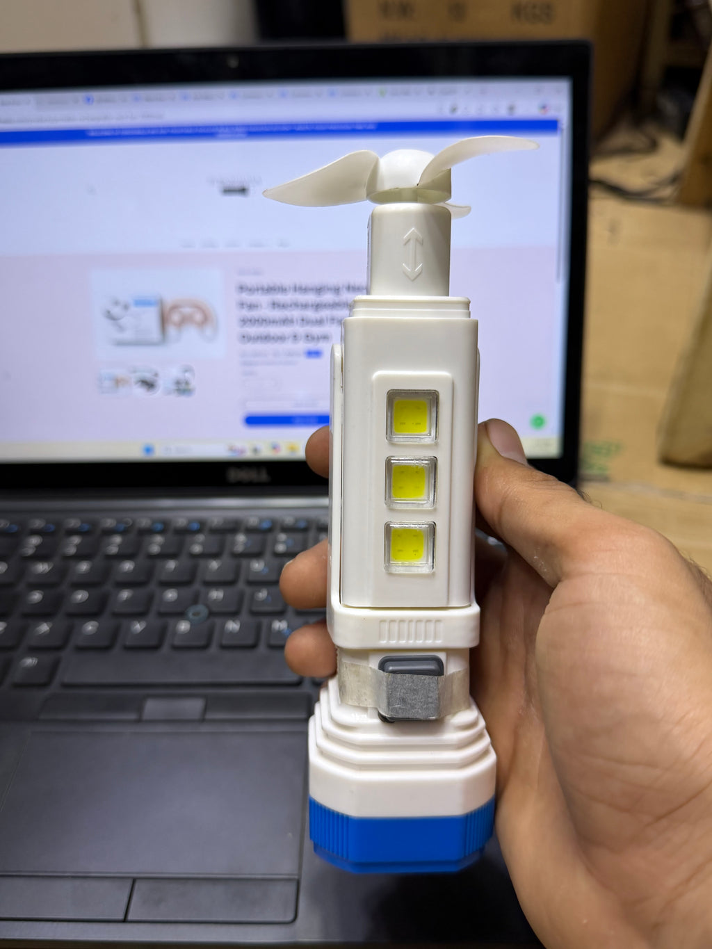 Solar rechargeable LED torch with mini fan front view showing COB light panel